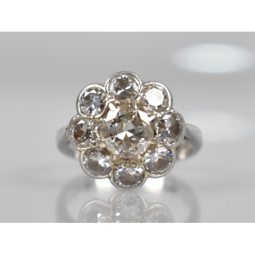 10 - A Platinum and Diamond Daisy Cluster Ring (At Fault), Central Round Cut Diamond Measuring 6.31mm Dia... 