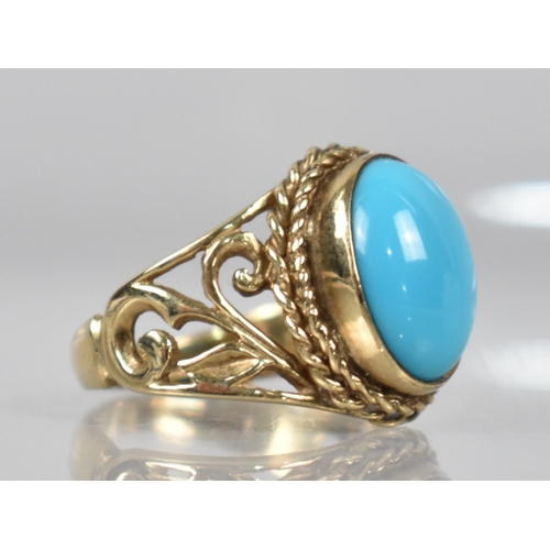 81 - A 9ct Gold and Turquoise Dress Ring, Central Oval Cabochon Stone Measuring 10mm x 13.5mm, Collet Set... 