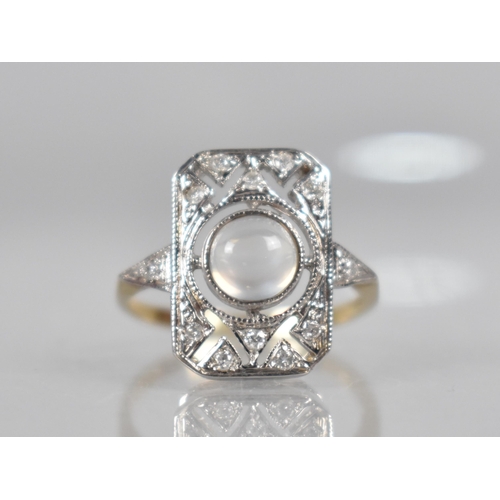 115 - A Diamond and Moonstone Art Deco Style Dress Ring, Round Cabochon Cut Moonstone Measuring 5.9mm Diam... 