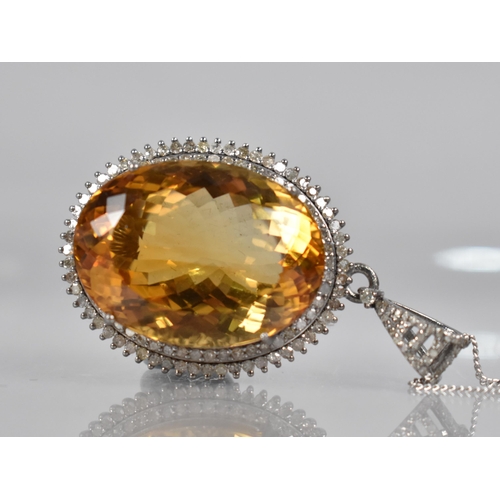 116 - A Large Citrine and Diamond Mounted White Metal Pendant, Central Oval Cut Citrine Measuring 44.55ct ... 