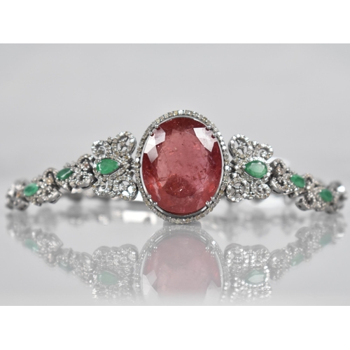 117 - A Rubellite, Emerald and Diamond Bracelet. Large Oval Cut Rubellite Stone Measuring 26.42cts, 22.9mm... 