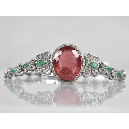 117 - A Rubellite, Emerald and Diamond Bracelet. Large Oval Cut Rubellite Stone Measuring 26.42cts, 22.9mm... 