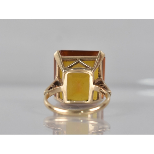 68 - A 9ct Gold and Untested Citrine Type Stone Cocktail Ring, Emerald Cut Stone Measuring 15.9mm by 18.1... 