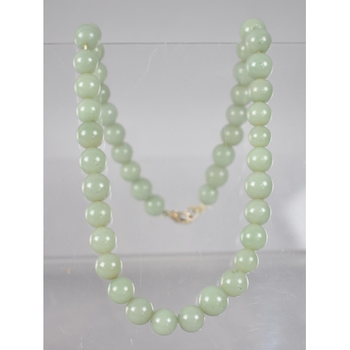 238 - A Single Row Jadeite Type Bead Necklace, Spherical Beads in Matched Colour but Varying Diameters Bet... 