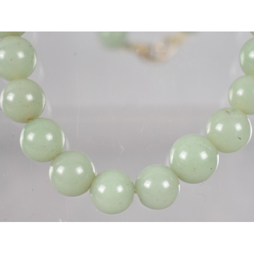 238 - A Single Row Jadeite Type Bead Necklace, Spherical Beads in Matched Colour but Varying Diameters Bet... 