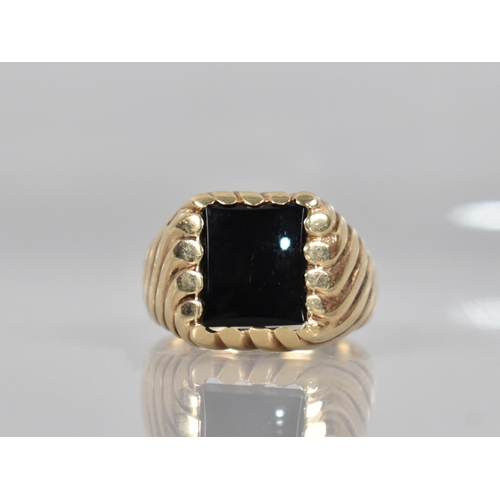 152 - A 9ct Gold Gents Signet Ring, Rectangular Onyx Panel (11.1mm by 9.7mm) Supported on a Fluted Head, S... 