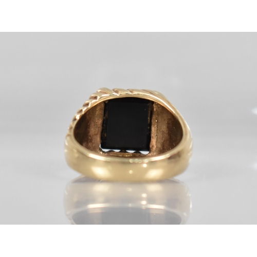 152 - A 9ct Gold Gents Signet Ring, Rectangular Onyx Panel (11.1mm by 9.7mm) Supported on a Fluted Head, S... 