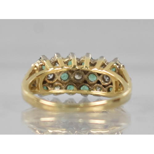 93 - An 18ct Gold, Emerald and Diamond Cluster Ring Comprising Seven Claw Set Round Brilliant Cut Diamond... 