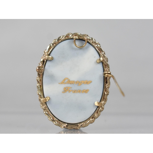 96 - A 9ct Gold Framed Limoges Brooch, Blue Enamelled Ground with Gilt Decoration Depicting Lovers in Gar... 