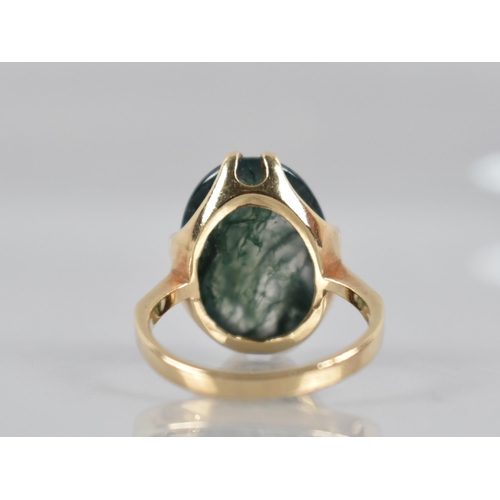 27 - A 9ct Gold Mounted Moss Agate Ring, Cabochon Stone Measuring 18mm by 13mm Set in Split Claws, Revers... 