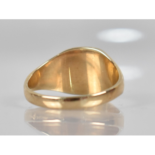 164 - A 9ct Gold Signet Ring, Rectangular Panelled Head to Wide Tapered Shoulders and a Plain Polished Ban... 