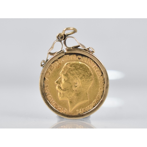 3 - A George V 1911 Sovereign in a 9ct Gold Mount, 9.4gms