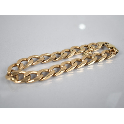 166 - A Heavy Italian 9ct Gold Flattened Curb Link Bracelet, 23.3cms Long, London Import Mark, 39gms