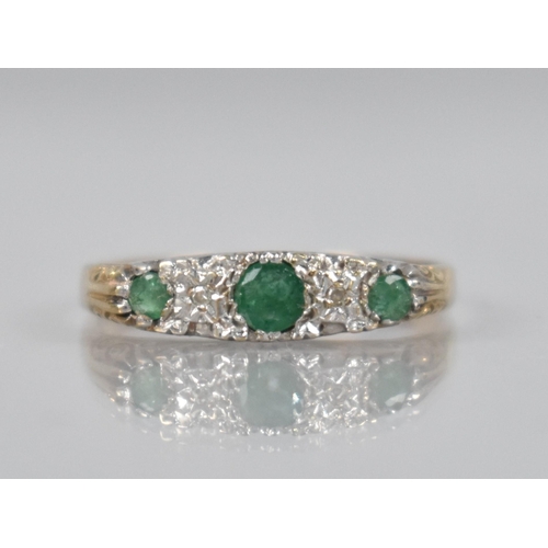 134 - An Emerald and Diamond Five Stone Boat Ring, Central  Mixed Cut Emerald Measuring 18.7mm by 17mm in ... 