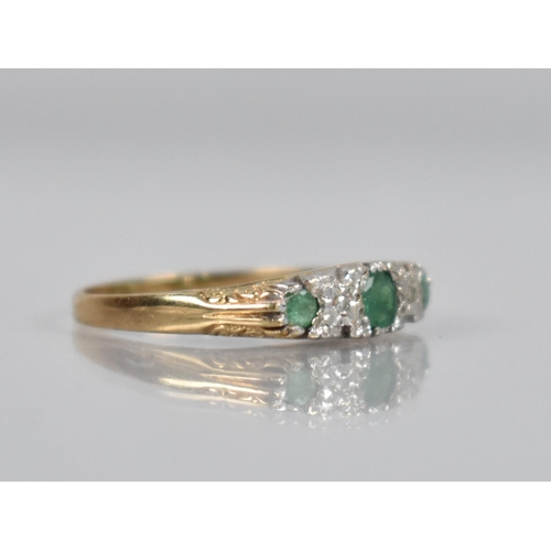 134 - An Emerald and Diamond Five Stone Boat Ring, Central  Mixed Cut Emerald Measuring 18.7mm by 17mm in ... 