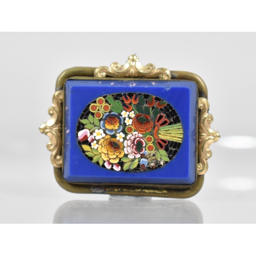 254 - A Pretty Victorian Micro Mosaic Brooch depicting Flowers Tied with Ribbon in Black Oval and on Blue ... 