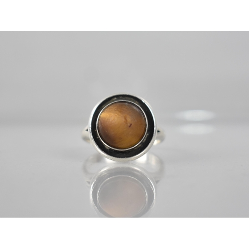 220 - N.E.From: A Danish Silver and Tigers Eye Ring, High Domed Circular Cabochon in Collet Mount with Bul... 