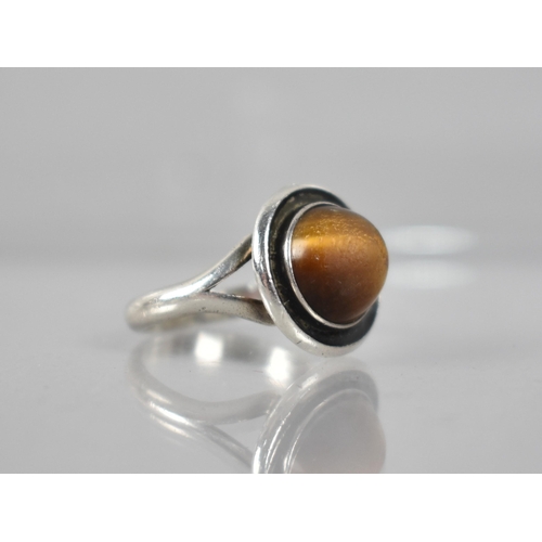 220 - N.E.From: A Danish Silver and Tigers Eye Ring, High Domed Circular Cabochon in Collet Mount with Bul... 