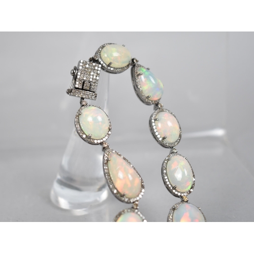 44 - An Opal and Diamond Necklace, 23 Mixed Shape Matched Opals Comprising Pear and Oval Cabochon, 93.52c... 