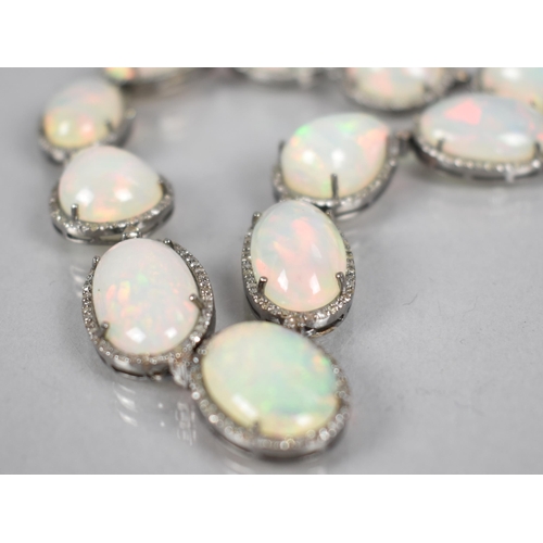 44 - An Opal and Diamond Necklace, 23 Mixed Shape Matched Opals Comprising Pear and Oval Cabochon, 93.52c... 