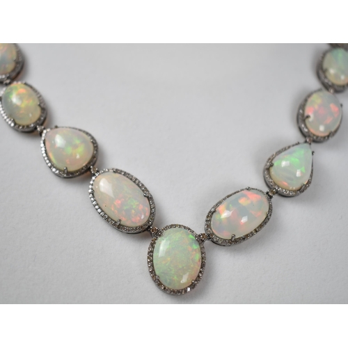 44 - An Opal and Diamond Necklace, 23 Mixed Shape Matched Opals Comprising Pear and Oval Cabochon, 93.52c... 