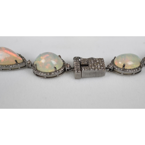 44 - An Opal and Diamond Necklace, 23 Mixed Shape Matched Opals Comprising Pear and Oval Cabochon, 93.52c... 