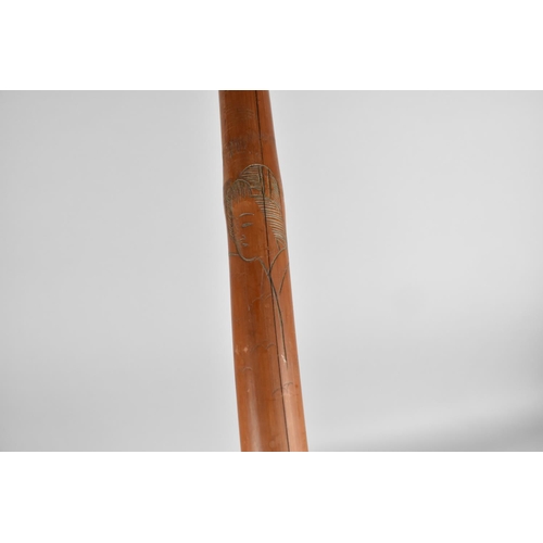 133 - An Oriental Carved Bamboo Walking Cane, 95cms Long