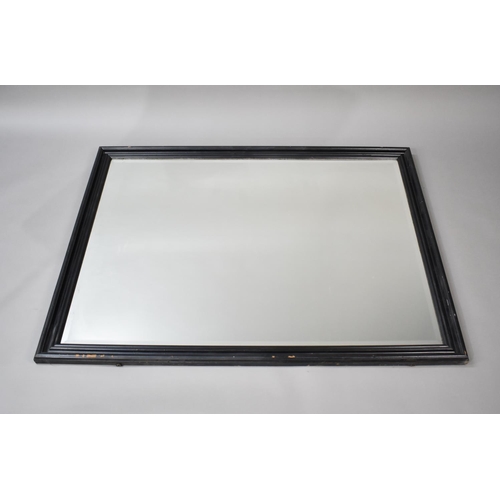 269 - A Large Ebonized Framed Rectangular Wall Mirror, 134cms by 104cms