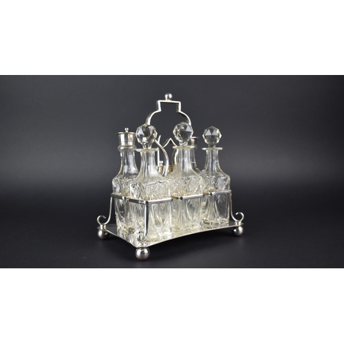 61 - An Edwardian Silver Plated Six Bottle Cruet Set