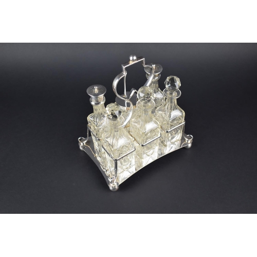 61 - An Edwardian Silver Plated Six Bottle Cruet Set