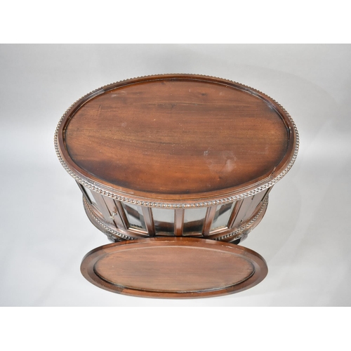 87 - A Reproduction Mahogany Oval Tray Top Bijouterie Cabinet of Oval Form on Cabriole Supports, 68cms Wi... 