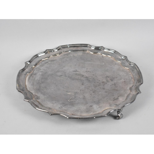 91 - A Mid 20th Century Silver Plated Salver on Three Scrolled Feet, 30cms Diameter