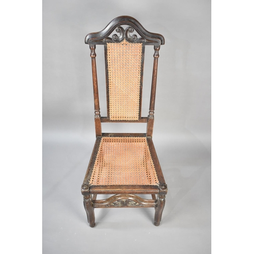 97 - A 19th Century Cane Seated and Backed Oak Framed Side Chair with Pierced and Arched Top Rail