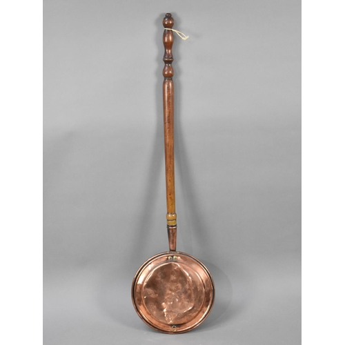 495 - A Copper Bed Pan with Turned Wooden Handle