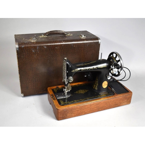 71 - A Singer Electric Sewing Machine in Case with Foot Pedal