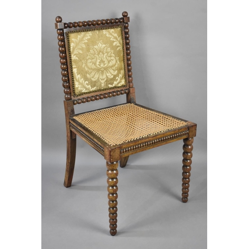 76 - A Late 19th Century Bobbin Framed Cane Seated Side Chair