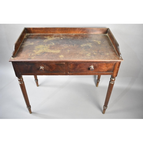 115 - A 19th Century Mahogany Galleried Side Table with Two Single Drawers on Turned Supports, 89x46x82cms... 