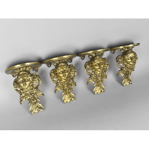 124 - A Set of Four Cast Brass Wall Sconces Modelled with Maidens Head Amongst Foliage and Acanthus Sprays... 