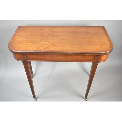 131 - A 19th Century String Inlaid Games Table with Baize Top, Tapering Square Supports Culminating in Cas... 