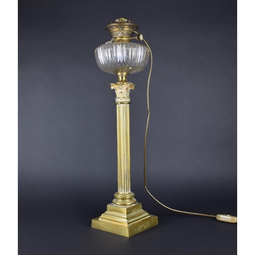 34 - A Tall Brass Oil Lamp Having Plain Cut Glass Reservoir Raised on a Corinthian Column with Tapering P... 