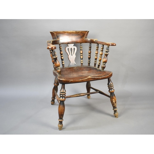 501 - An Early 20th Century Smokers Bow Tub Armchair with Spindle and Vase Pierced Back on Turned Supports