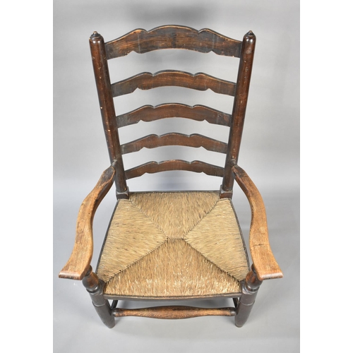 504 - A 19th Century Oak Framed Rush Seated Armchair