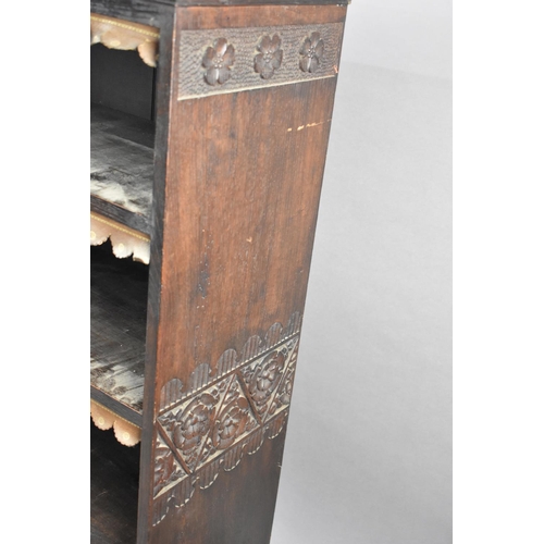 59 - An Early 20th Century Oak Four Shelf Bookcase with Tooled Leather Fringes and Carved Decoration to S... 