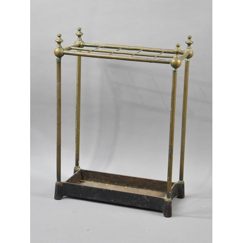 61 - A Late 19th/Early 20th Century Brass Framed Ten Section Stick Stand with Vase Finials on Cast Metal ... 