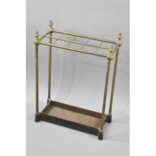 61 - A Late 19th/Early 20th Century Brass Framed Ten Section Stick Stand with Vase Finials on Cast Metal ... 