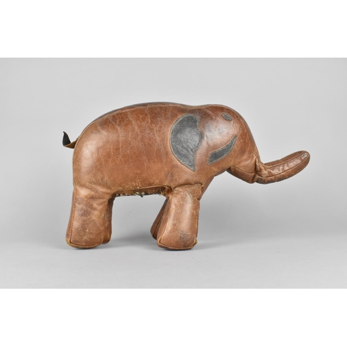 63 - A Small Vintage Brown Stitched Leather Covered Footstool in the Form of an Elephant, in the Manner o... 