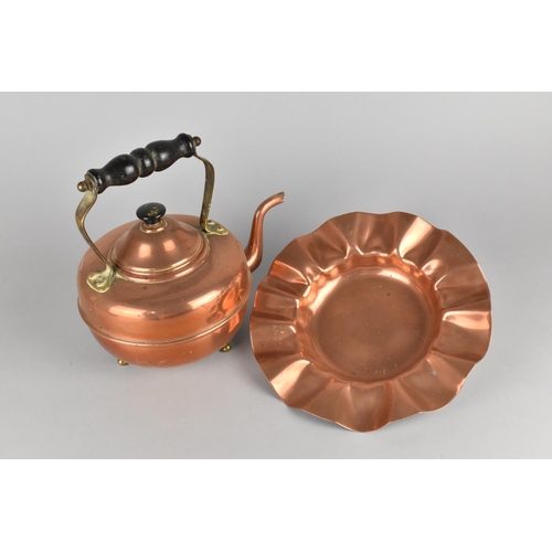 69 - A Copper Kettle with Wooden Handle and Three Brass Ball Feet together with a Copper Dish