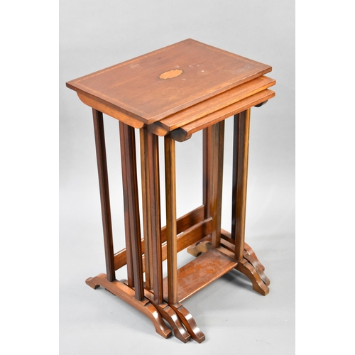 82 - A Mahogany String Inlaid Nest of Three Tables, the Tops with Central Inlaid Fan Decoration, 41x61cms... 