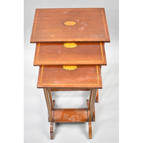 82 - A Mahogany String Inlaid Nest of Three Tables, the Tops with Central Inlaid Fan Decoration, 41x61cms... 