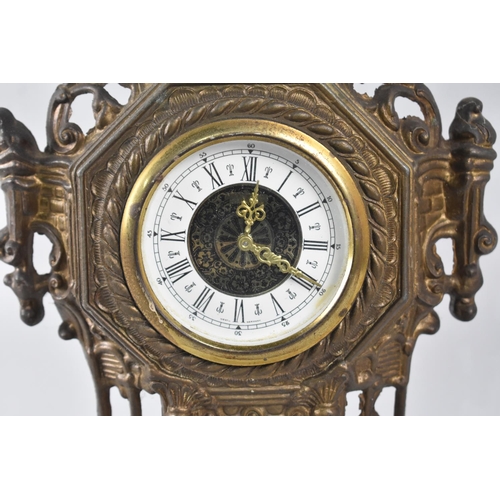 92 - An Ornate Cast and Pierced Brass Clock, 36cms High